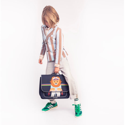 Boy wearing Jeune Premier It Bag Midi King of the Cobbles school bag, age 6 to 8