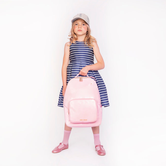 Girl wearing Jeune Premier New Bobbie Blush ergonomic school backpack, age 6 and up