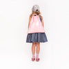 Girl wearing Jeune Premier City Bag Blush as a backpack, convertible straps