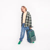 Boy wearing Jeune Premier New Bobbie Puffer Green school backpack, age 6 and up
